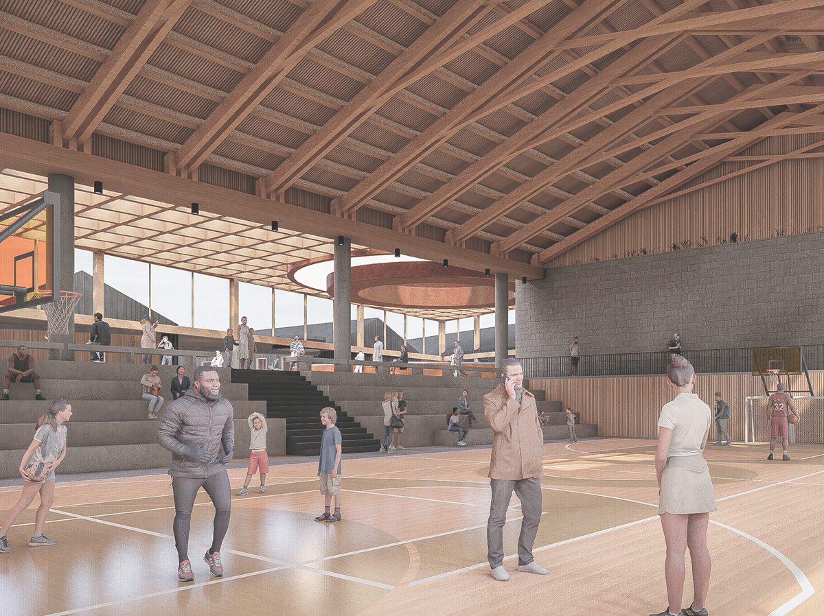 Interior del polideportivo con estructura de madera